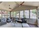 Relaxing sunroom with multiple windows providing natural light and views of the surrounding landscape at 260 W Peachtree St, Norcross, GA 30071