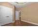 Bedroom with hardwood flooring, closet, and a doorway to another room at 3209 Telhurst Way, Buford, GA 30519