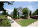 Charming home exterior with manicured landscaping, lush lawn, and a welcoming walkway at 3209 Telhurst Way, Buford, GA 30519