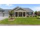 Charming home featuring brick facade, covered porch, and manicured lawn at 3209 Telhurst Way, Buford, GA 30519