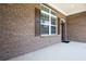 Exterior entrance featuring beautiful brick, shutters and trim at 3209 Telhurst Way, Buford, GA 30519