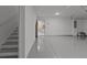 Spacious garage with epoxy flooring and access to the kitchen and the stairs to the second floor at 3209 Telhurst Way, Buford, GA 30519