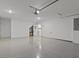 Clean, spacious garage with epoxy flooring and ample storage space, perfect for any car enthusiast at 3209 Telhurst Way, Buford, GA 30519