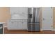 Bright kitchen showcasing stainless steel refrigerator and classic white cabinetry at 3209 Telhurst Way, Buford, GA 30519