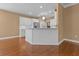 Open-concept living area with hardwood floors and kitchen view at 3209 Telhurst Way, Buford, GA 30519