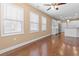 Large living room featuring big windows for natural light with an open floorplan at 3209 Telhurst Way, Buford, GA 30519