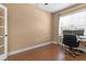 Bright home office with hardwood floors, large window, and space for dual monitors at 3209 Telhurst Way, Buford, GA 30519