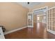 Office with hardwood floors and glass panel door to another room of the house at 3209 Telhurst Way, Buford, GA 30519
