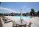 Community pool with ample lounge seating and tables, perfect for relaxing on a sunny day at 3209 Telhurst Way, Buford, GA 30519