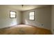 Bedroom featuring hardwood flooring and two windows allowing natural light at 400 Mccart Rd, Mcdonough, GA 30252