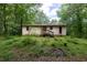 Exterior view of the property showcasing the facade and surrounding landscape at 400 Mccart Rd, Mcdonough, GA 30252
