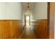 Hallway features wood paneling and access to the attic via a ceiling hatch at 400 Mccart Rd, Mcdonough, GA 30252