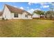 Expansive backyard featuring a well-maintained lawn and a classic white home exterior, perfect for outdoor activities at 105 Hunters, Mcdonough, GA 30253