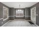 Dining area with tile floors, gray walls, white trim, and lots of natural light at 105 Hunters, Mcdonough, GA 30253