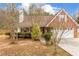 Charming brick home featuring a well-maintained lawn and attached two-car garage at 105 Hunters, Mcdonough, GA 30253