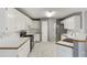 Well-lit kitchen with white cabinetry, stainless steel appliances, and tiled backsplash at 105 Hunters, Mcdonough, GA 30253