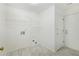This laundry room offers shelving and washer-dryer hookups at 105 Hunters, Mcdonough, GA 30253