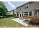 Patio with outdoor seating, surrounded by lush green lawn and mature trees at 115 Dunlavin Dr, Acworth, GA 30102