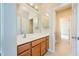 Bathroom features vanity with solid surface counter and stained wood cabinets at 115 Dunlavin Dr, Acworth, GA 30102