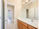 Bathroom features vanity with solid surface counter and stained wood cabinets at 115 Dunlavin Dr, Acworth, GA 30102