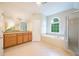Bright bathroom with a soaking tub, separate shower, and a vanity with double sinks and a large mirror at 115 Dunlavin Dr, Acworth, GA 30102