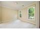 Bright bedroom with neutral walls, carpet flooring, and natural light from two large windows at 115 Dunlavin Dr, Acworth, GA 30102
