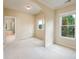 Comfortable bedroom with soft carpet, natural light from the window, and an arched doorway feature at 115 Dunlavin Dr, Acworth, GA 30102