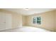 Neutral bedroom with carpet, a double door closet and a bright window at 115 Dunlavin Dr, Acworth, GA 30102