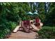 Playground with slides, stairs, and covered lookout points at 115 Dunlavin Dr, Acworth, GA 30102