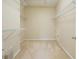 Spacious walk-in closet with carpet and wire shelving for ample storage at 115 Dunlavin Dr, Acworth, GA 30102