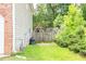 View of the backyard with a playset and lush green grass at 1849 Wanda Way, Ellenwood, GA 30294