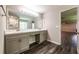 The ensuite bathroom features double vanity, a large mirror, and a walk-in shower at 1849 Wanda Way, Ellenwood, GA 30294