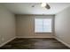 This bedroom features hardwood floors and a window with a blind at 1849 Wanda Way, Ellenwood, GA 30294