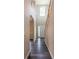 Bright foyer featuring hardwood floors and a staircase with white risers and wood railing at 1849 Wanda Way, Ellenwood, GA 30294