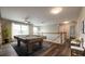 Spacious game room with pool table, wood floors, ceiling fan, and ample natural light at 1849 Wanda Way, Ellenwood, GA 30294