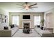 Elegant living room with a cozy fireplace, two couches and lots of natural light at 1849 Wanda Way, Ellenwood, GA 30294