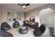 Inviting living room with cozy beanbag chairs and a large screen tv at 1849 Wanda Way, Ellenwood, GA 30294