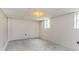 This basement has concrete flooring, light walls, and two windows for natural light at 4133 Conley Circle Cir, Conley, GA 30288