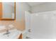 Bathroom featuring a tub/shower combo with white tile and a single sink vanity at 4133 Conley Circle Cir, Conley, GA 30288