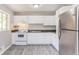 Updated kitchen features white cabinetry, modern appliances, and durable countertops at 4133 Conley Circle Cir, Conley, GA 30288