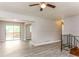 Bright living room boasts hardwood floors and a sliding glass door to the outdoor patio at 4133 Conley Circle Cir, Conley, GA 30288