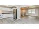 Open-concept living area seamlessly connects the kitchen and living spaces for easy entertaining at 4133 Conley Circle Cir, Conley, GA 30288
