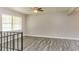 Spacious living area has hardwood floors and a large window, creating an inviting atmosphere at 4133 Conley Circle Cir, Conley, GA 30288