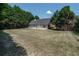 Aerial view of the backyard and back exterior of the home at 1200 Martins Chapel Se Ln, Lawrenceville, GA 30045