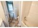 Bathroom with a shower and tub combination, tiled floors, and a view into the bedroom at 1200 Martins Chapel Se Ln, Lawrenceville, GA 30045