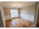 Dining room showcases hardwood floors and large window with natural light at 1200 Martins Chapel Se Ln, Lawrenceville, GA 30045