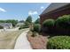 View of the front yard, landscaping, sidewalk, and view of neighbor's homes at 1200 Martins Chapel Se Ln, Lawrenceville, GA 30045