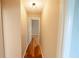 Hallway featuring hardwood floors and neutral colored walls at 1200 Martins Chapel Se Ln, Lawrenceville, GA 30045