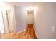 Hallway featuring hardwood floors and neutral colored walls at 1200 Martins Chapel Se Ln, Lawrenceville, GA 30045