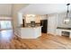 Bright kitchen area featuring granite counters, stainless appliances and hardwood floors at 1200 Martins Chapel Se Ln, Lawrenceville, GA 30045